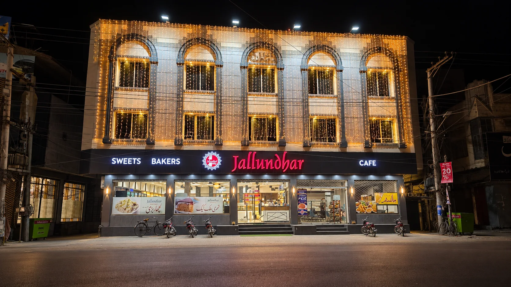 Jallundhar Sweets & Bakers shop exterior on Shahi Road at night